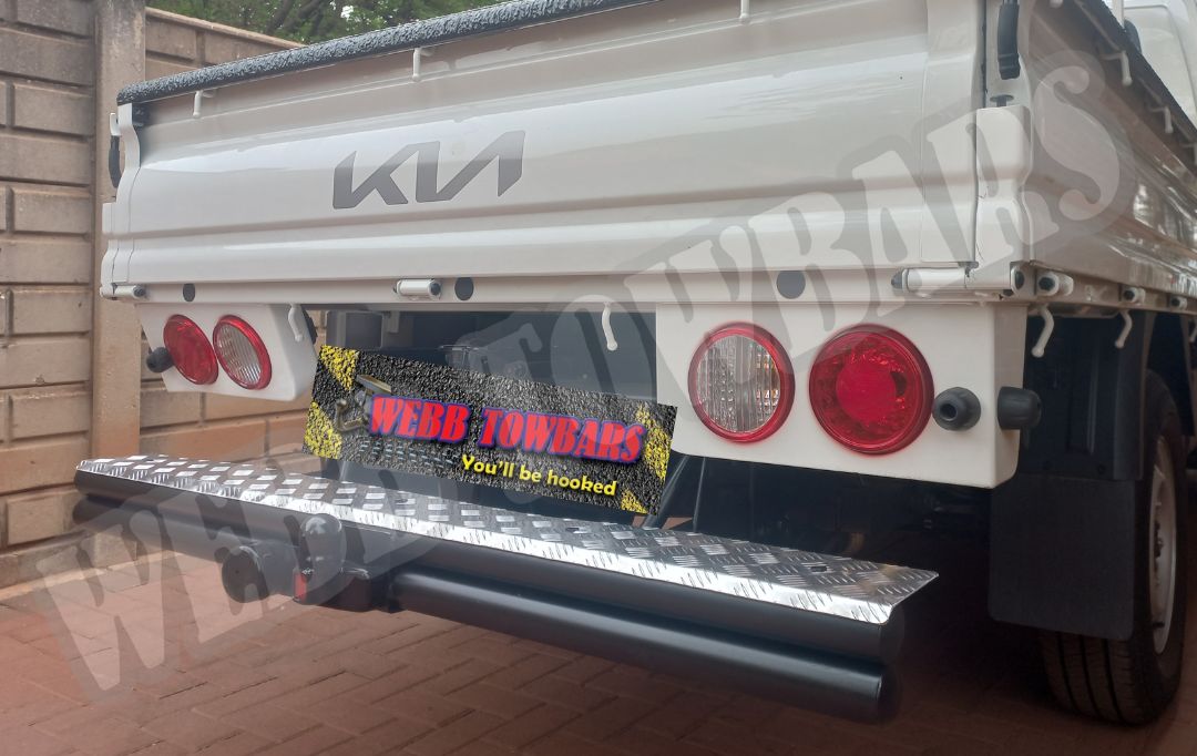 Kia K2500 fitted with a double tube and step towbar, expertly manufactured and installed by Webb Towbars in Gauteng, South Africa, for enhanced towing capacity and convenience.