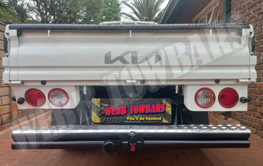 Kia K2500 fitted with a double tube and step towbar, expertly manufactured and installed by Webb Towbars in Gauteng, South Africa, for enhanced towing capacity and convenience.