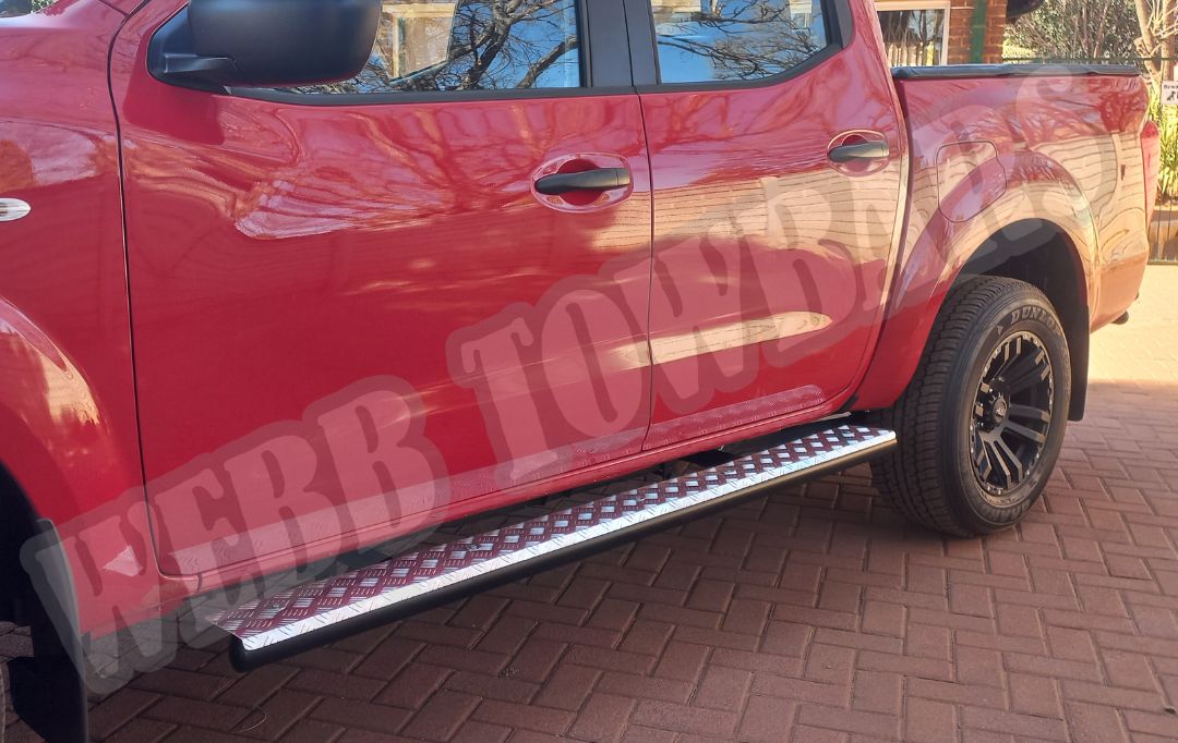 Nissan Navara with durable standard side steps, designed and fitted by Webb Towbars in Gauteng, South Africa for added convenience and accessibility.