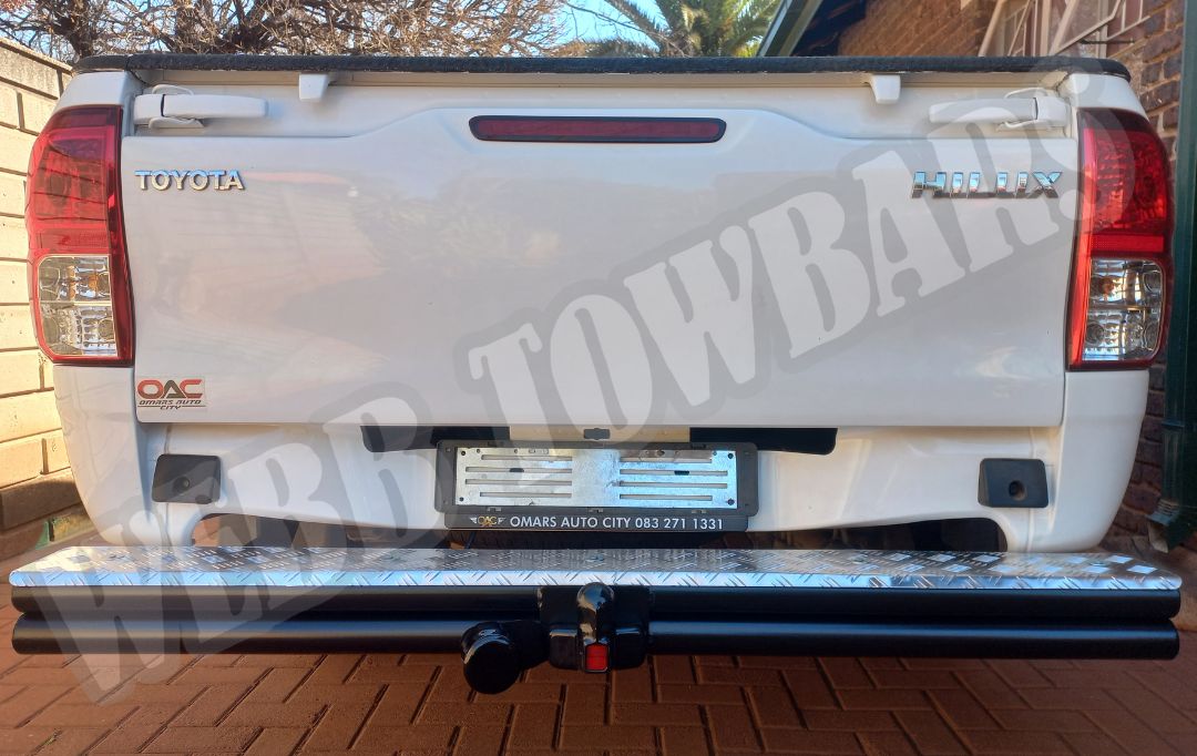 Toyota Hilux equipped with a double tube and step towbar, manufactured and fitted by Webb Towbars in Gauteng, South Africa, for enhanced towing capability and accessibility.