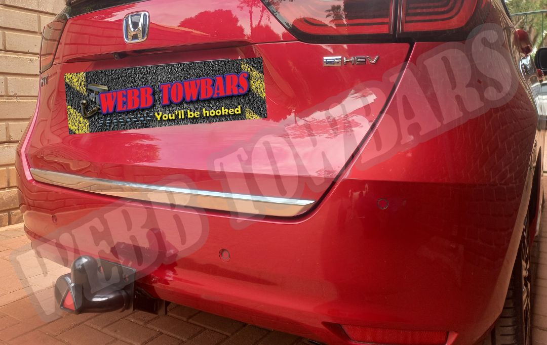 Honda Fit with a standard towbar, custom manufactured and installed by Webb Towbars in Gauteng, South Africa, ensuring reliable towing capability.