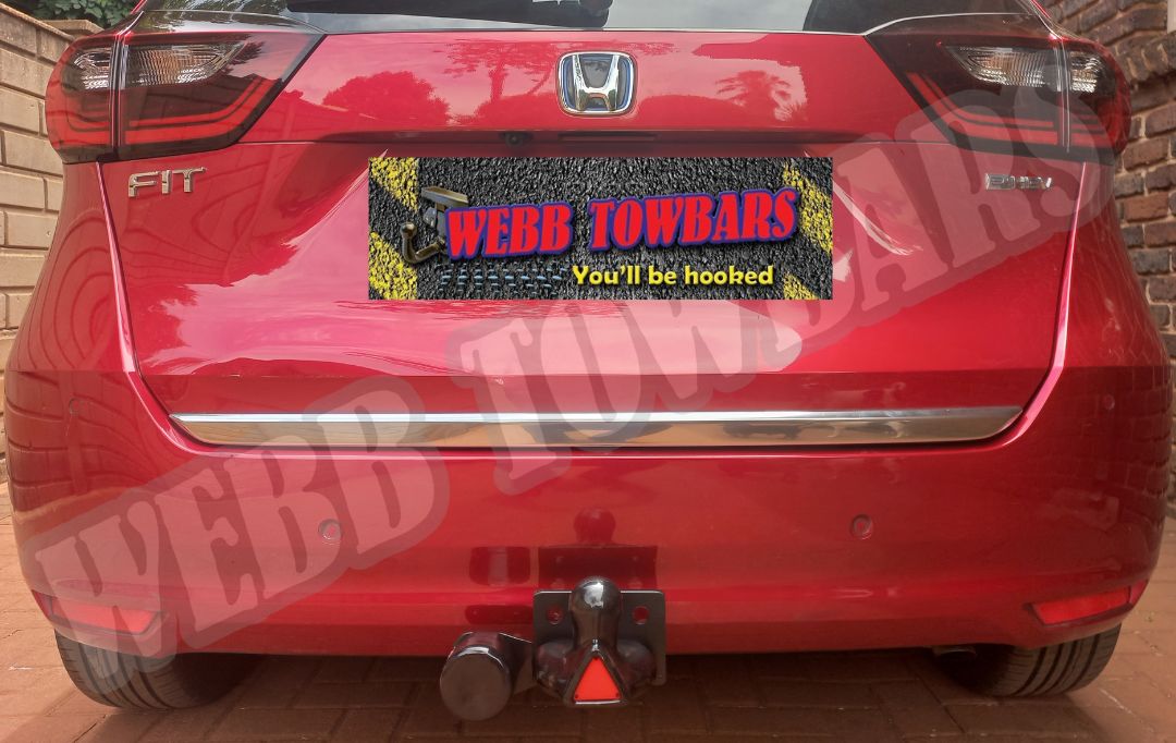 Honda Fit with a standard towbar, custom manufactured and installed by Webb Towbars in Gauteng, South Africa, ensuring reliable towing capability.