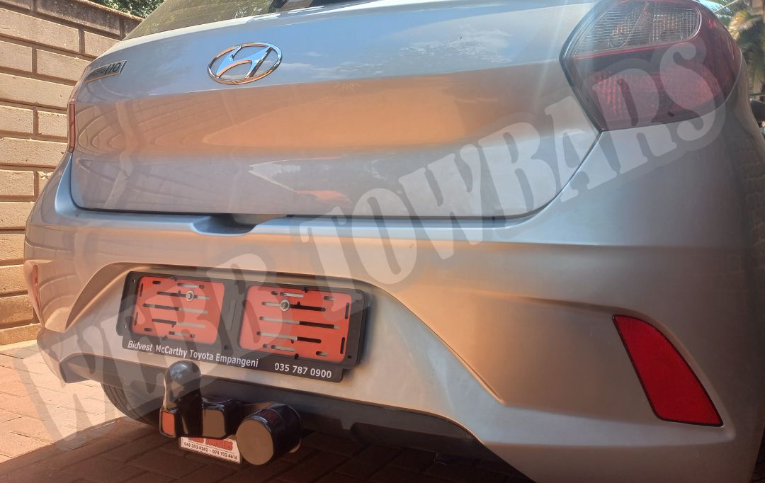 Hyundai i10 Grand equipped with a standard towbar, manufactured and installed by Webb Towbars in Gauteng, South Africa for reliable towing solutions.