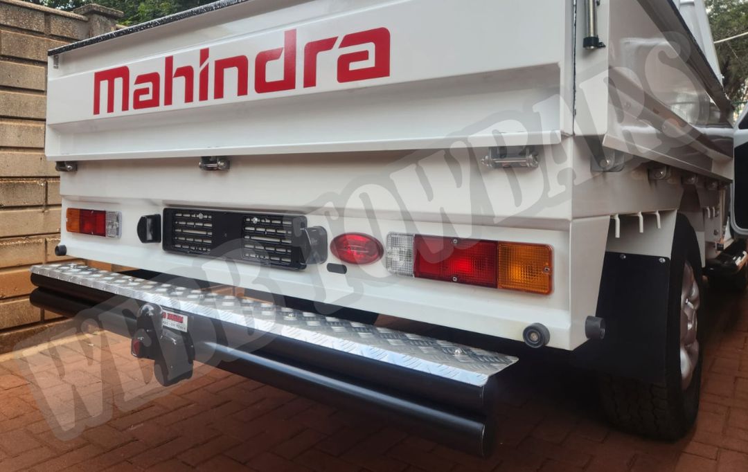 Webb Towbars - Mahindra Scorpio Dropside - Double Tube and Step Towbar professionally manufactured and expertly fitted by Webb Towbars in Gauteng, South Africa. Heavy-duty double tube and rear step towbar engineered specifically for the Mahindra Scorpio Dropside, delivering exceptional towing strength and added practicality for commercial and agricultural applications. Precision-manufactured for a secure vehicle-specific fit with a durable corrosion-resistant finish, this robust towbar provides reliable towing performance for trailers, work equipment and utility loads while the integrated rear step offers convenient access to the load bin, making it the ideal solution for hardworking Mahindra Scorpio Dropside owners across South Africa.