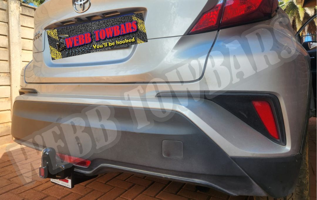 Webb Towbars - Toyota C-HR - Detachable Towbar professionally manufactured and expertly fitted by Webb Towbars in Gauteng, South Africa. Premium detachable towbar precision-engineered specifically for the Toyota C-HR, offering the perfect combination of discreet styling and dependable towing performance. Designed with a removable tow hitch to maintain the sleek factory appearance when not in use, this heavy-duty towbar is ideal for towing trailers, bicycle racks, luggage carriers and leisure equipment. Expertly manufactured for a secure vehicle-specific fit with a durable corrosion-resistant finish, it delivers exceptional strength, safety and long-lasting reliability. Professionally manufactured and installed by Webb Towbars, this detachable towing solution is the ideal choice for Toyota C-HR owners throughout Gauteng and South Africa seeking versatility without compromising the vehicle's modern design.