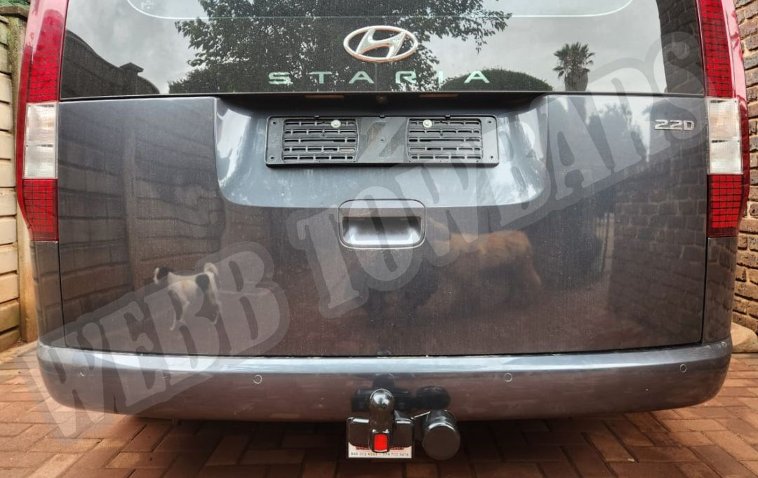 Webb Towbars - Hyundai Staria - Standard Towbar professionally installed by Webb Towbars in Gauteng, South Africa. Premium vehicle-specific standard towbar designed for the Hyundai Staria, providing dependable towing capability while complementing the vehicle’s distinctive modern styling and spacious, versatile design. Ideal for caravans, trailers, bicycle racks, luggage trailers and recreational equipment, this robust towbar offers a secure precision fit, durable corrosion-resistant finish and reliable long-term performance. Professionally installed by Webb Towbars, this towing solution enhances the Hyundai Staria for family holidays, business use, passenger transport, weekend adventures and everyday towing throughout Gauteng and South Africa.